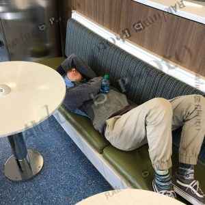 Teen sleeping in airport